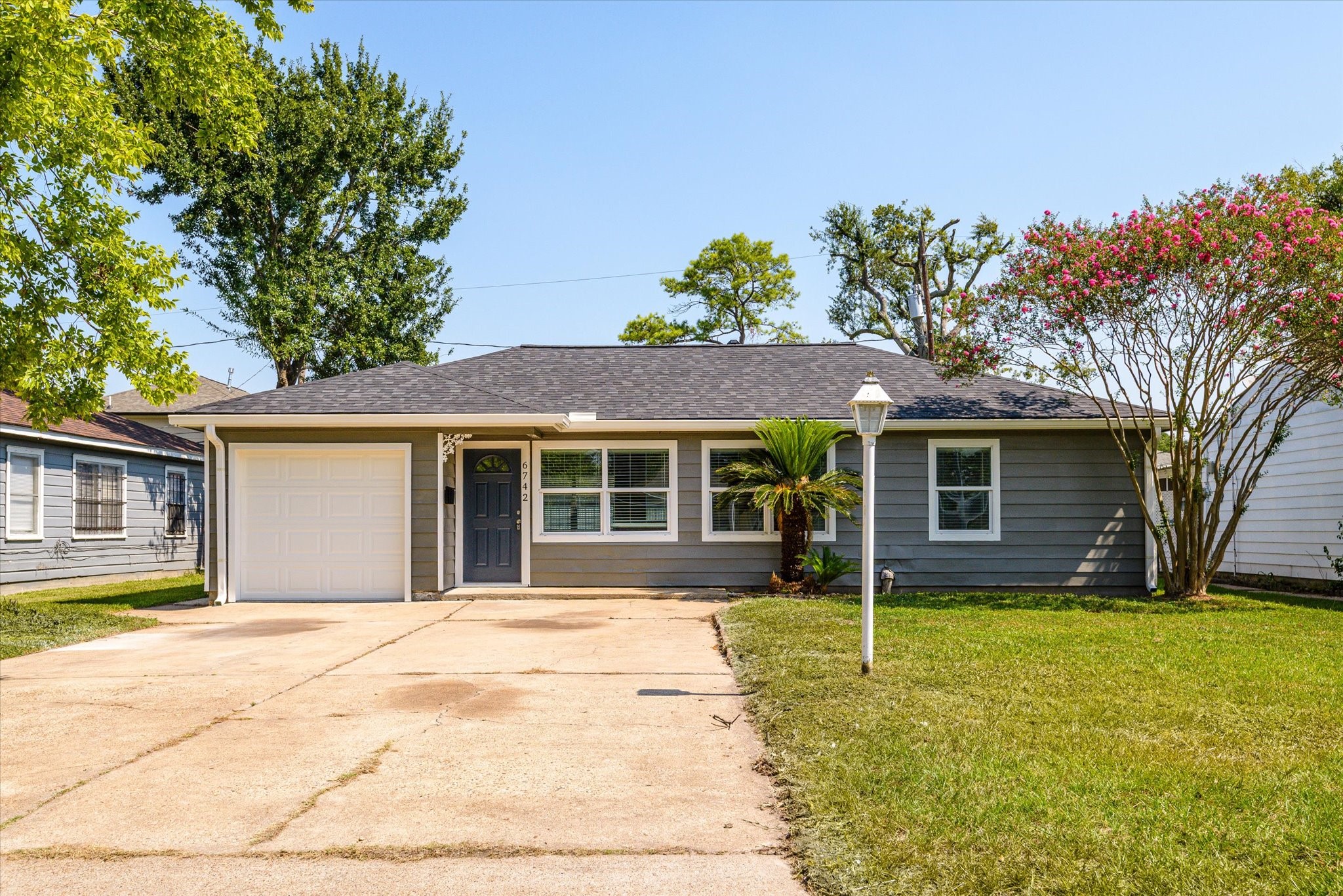 front view of a house with a yard