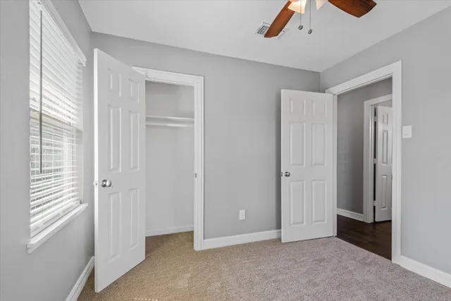 a bathroom with a sink a window and a shower