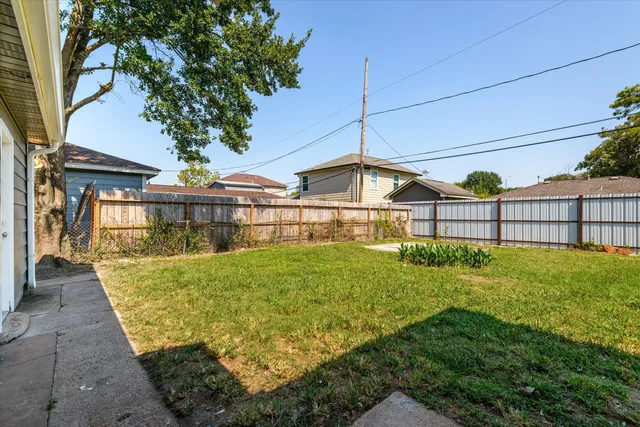 a view of backyard with a garden and plants