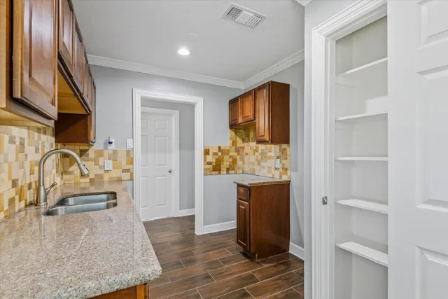 a view of kitchen island with furniture and wooden floor