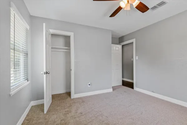 a view of empty room with windows