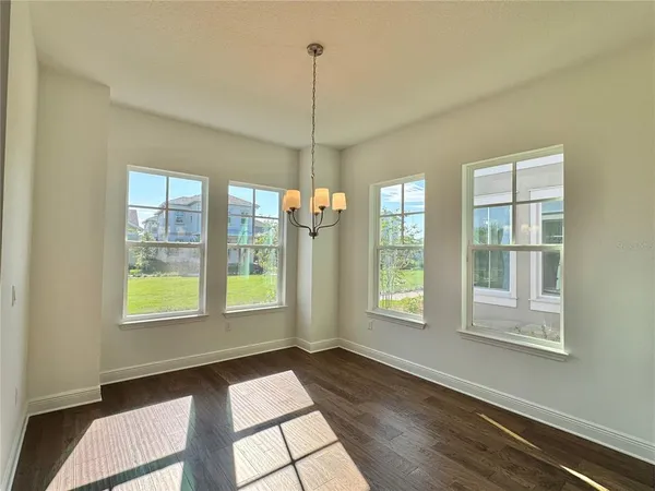 a view of an empty room with windows