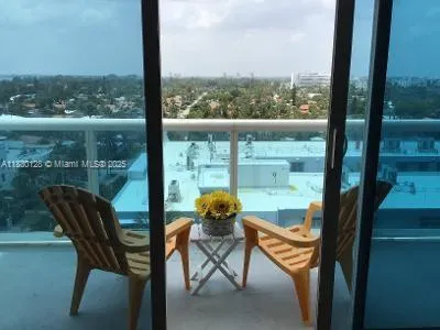 a view of a city from a dining room with large windows