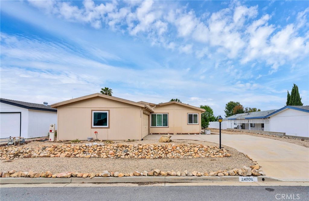 24800 Cornstalk Road Wildomar, CA 92595 - Photo 2 of 19 a view of a house with a pathway