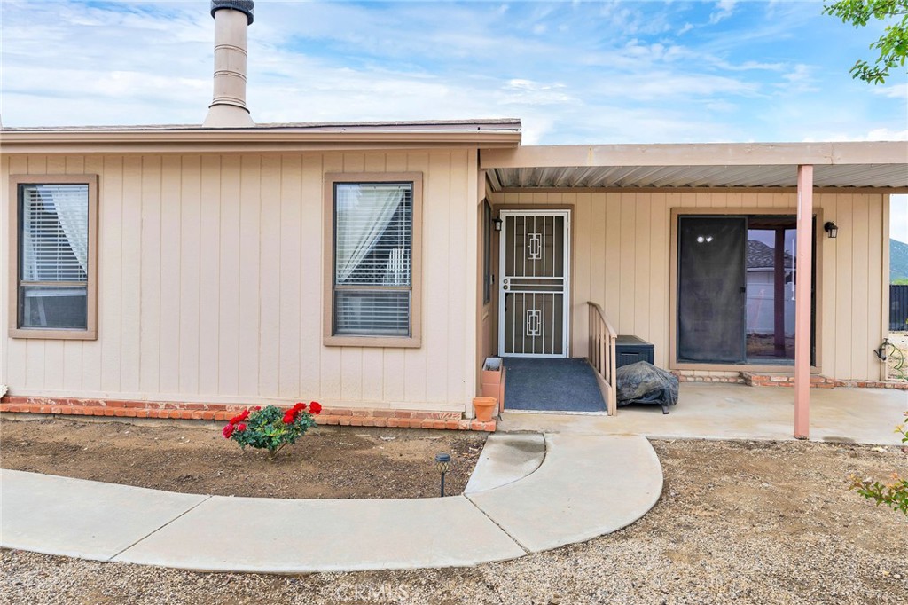 24800 Cornstalk Road Wildomar, CA 92595 - Photo 3 of 19 a front view of a house