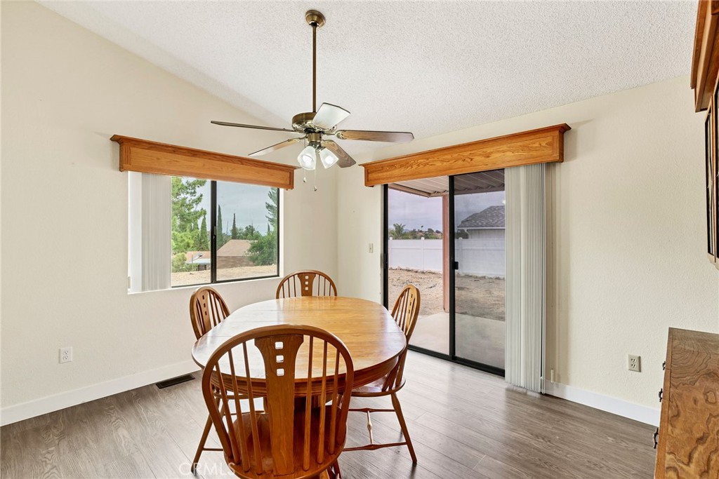 24800 Cornstalk Road Wildomar, CA 92595 - Photo 5 of 19 a view of a dining room with furniture window and wooden floor