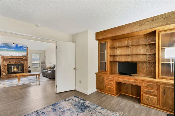 a view of living room with furniture and flat screen tv