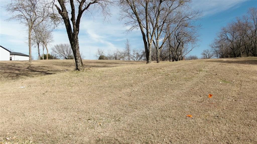 9108 Fossil Ridge Drive Grand Prairie, TX 75104 - Photo 2 of 10 View of green lawn with a view of rural / pastoral area
