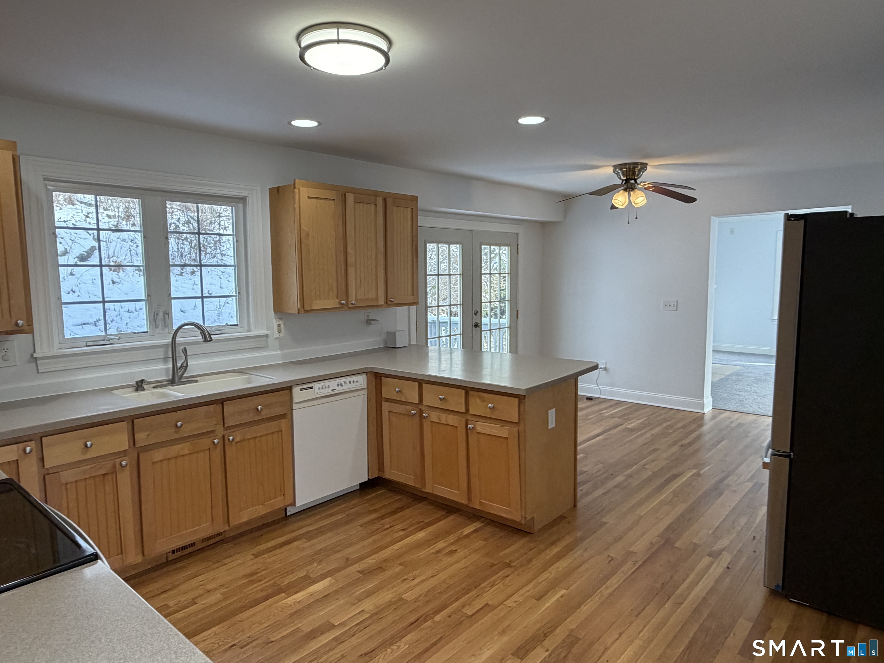 55 A Butterfield Road Newtown, CT 06470 - Photo 11 of 33 a large kitchen with granite countertop a large counter top space appliances and a window