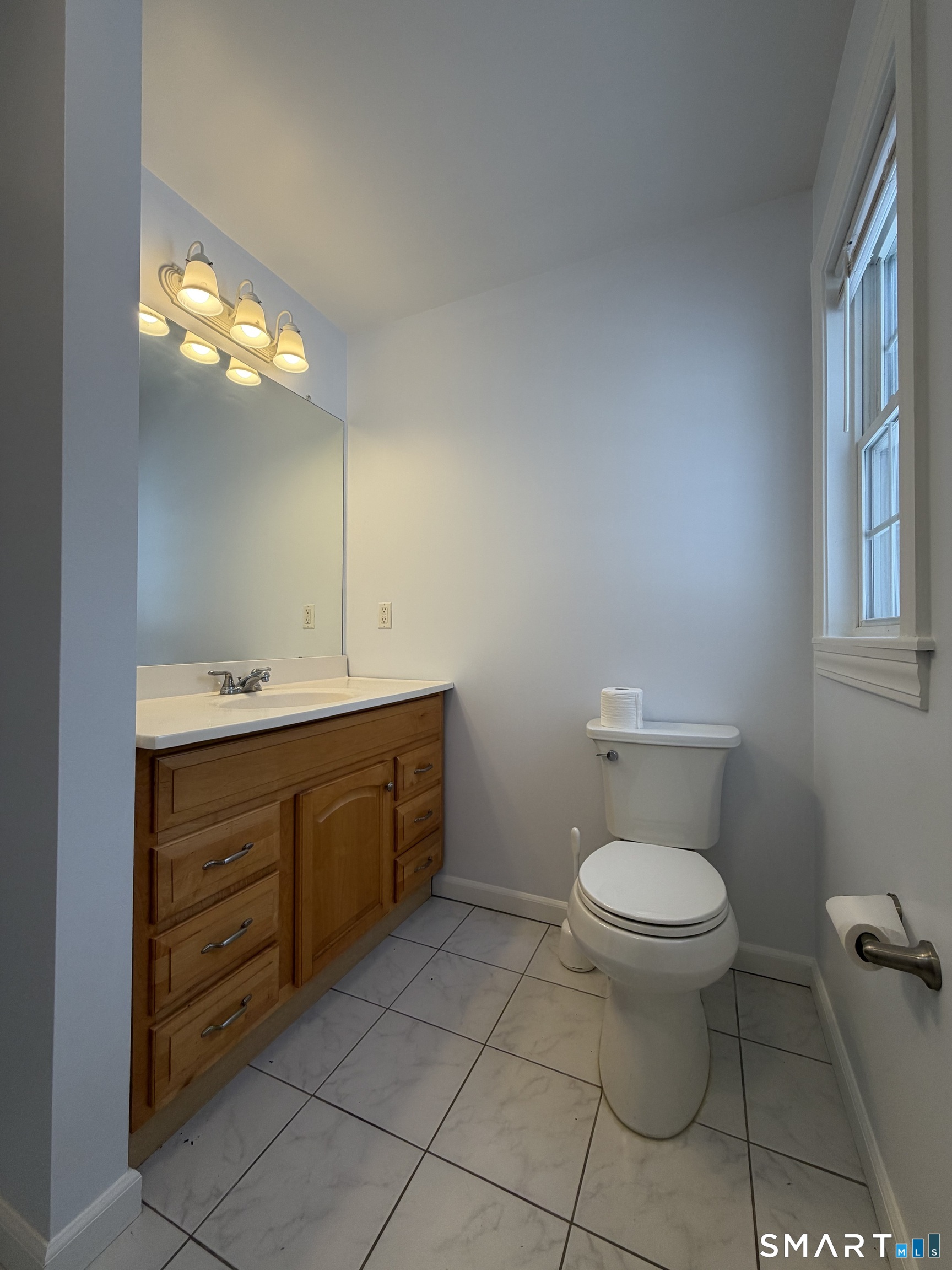 55 A Butterfield Road Newtown, CT 06470 - Photo 14 of 33 a bathroom with a toilet sink and mirror
