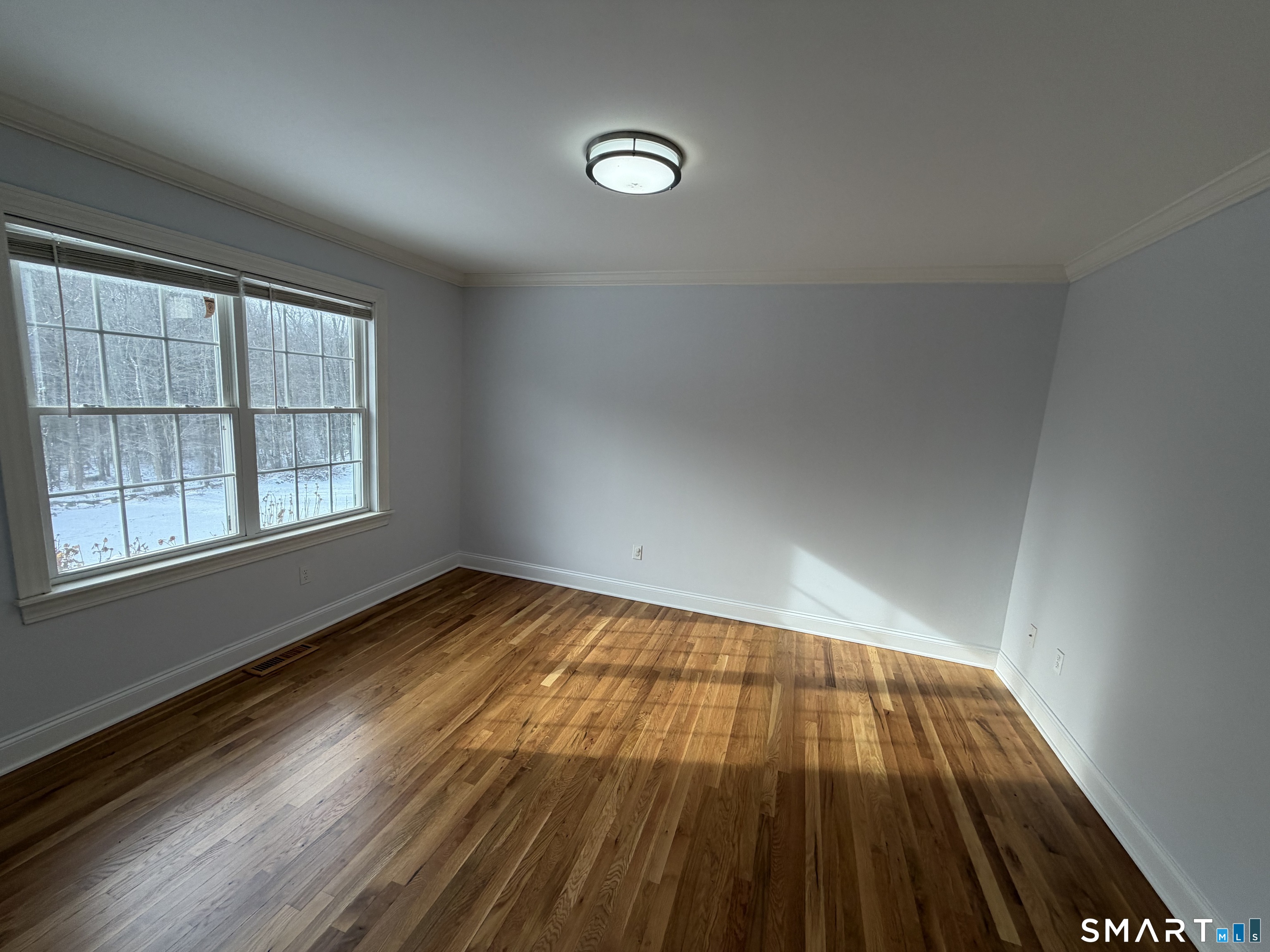 55 A Butterfield Road Newtown, CT 06470 - Photo 16 of 33 wooden floor in an empty room with a window