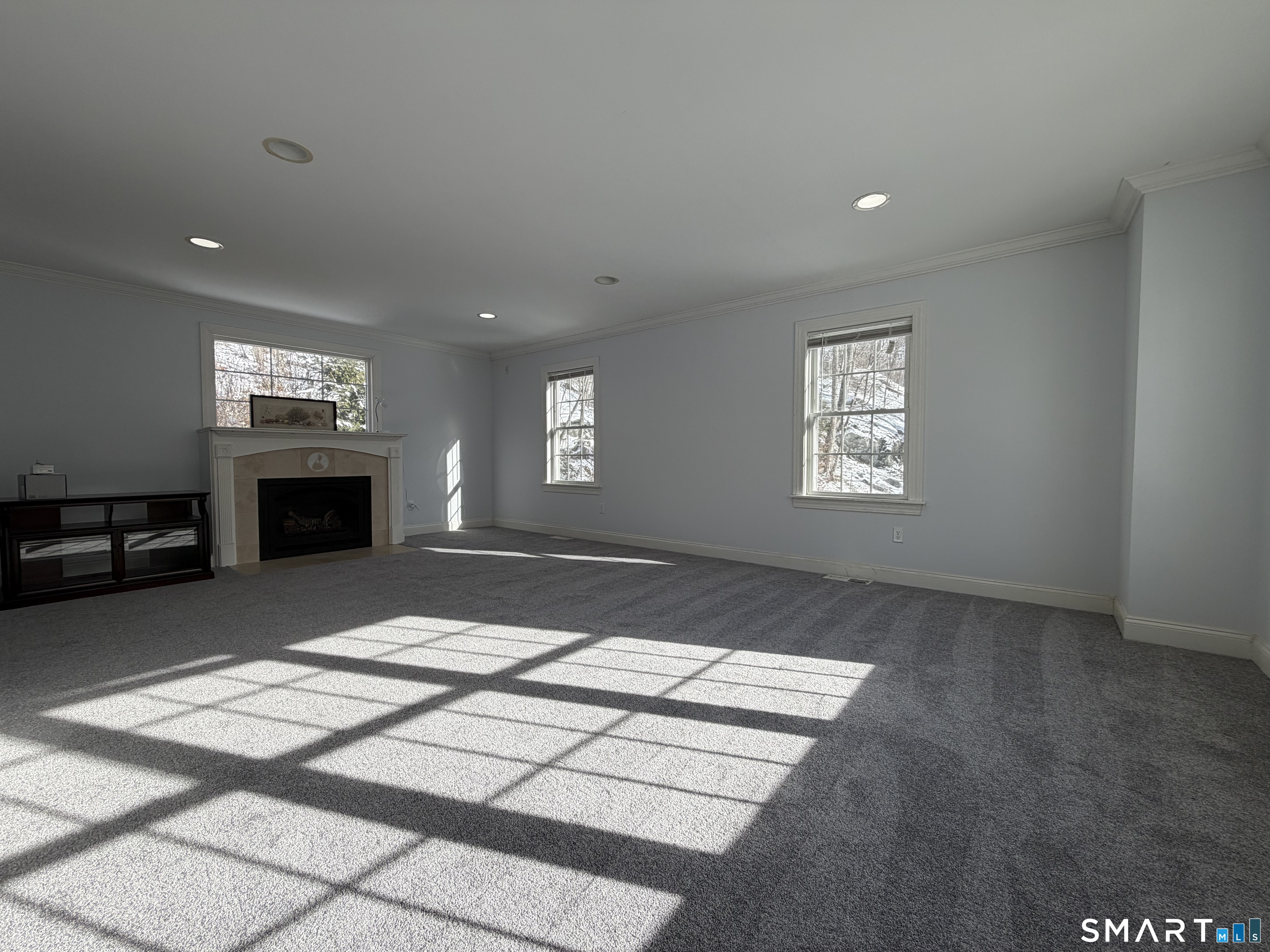 55 A Butterfield Road Newtown, CT 06470 - Photo 17 of 33 a view of a livingroom with a fireplace