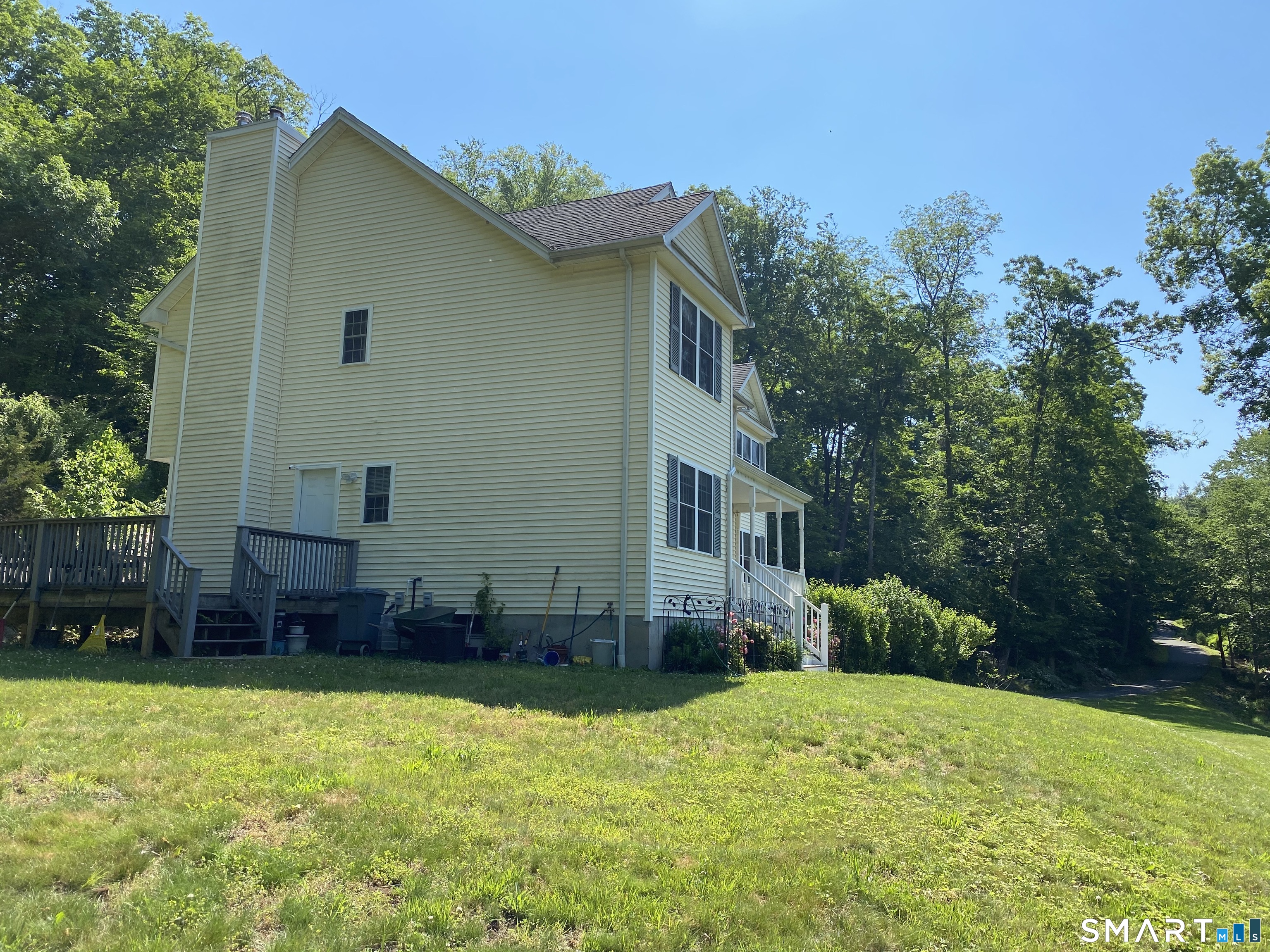 55 A Butterfield Road Newtown, CT 06470 - Photo 2 of 33 a backyard of a house with lots of green space