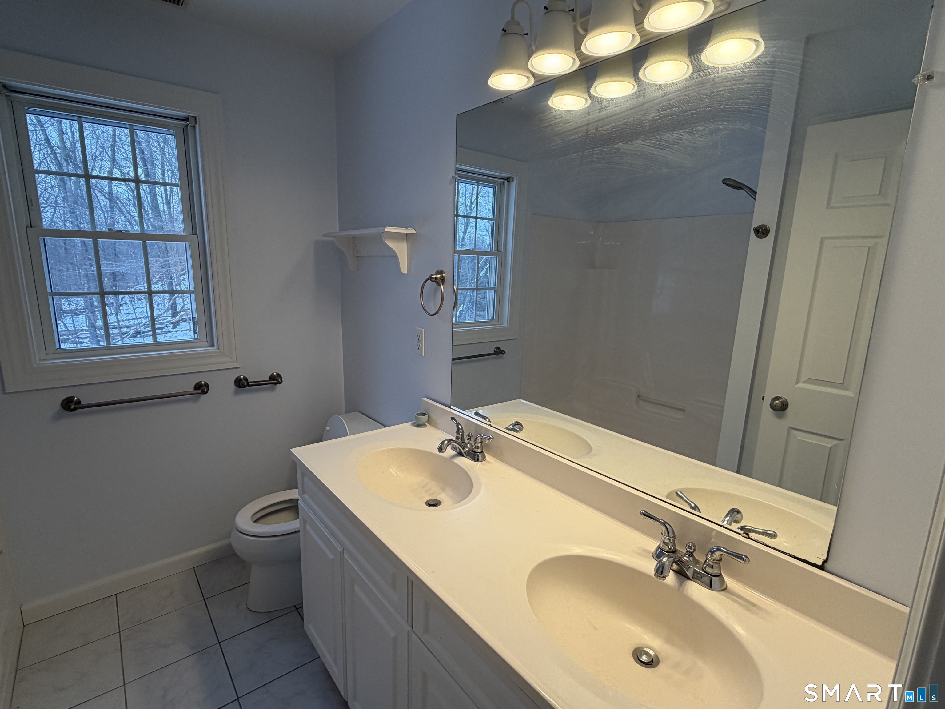 55 A Butterfield Road Newtown, CT 06470 - Photo 21 of 33 a bathroom with a sink mirror and toilet