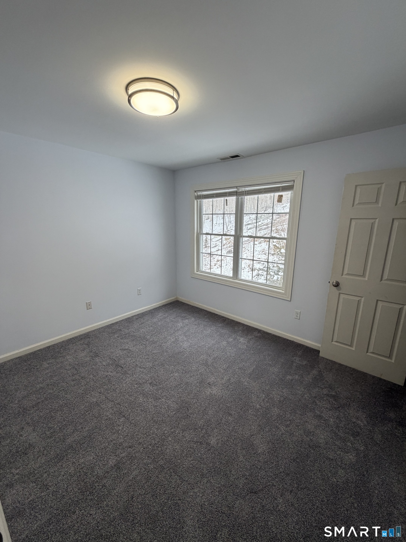 55 A Butterfield Road Newtown, CT 06470 - Photo 24 of 33 an empty room with a window