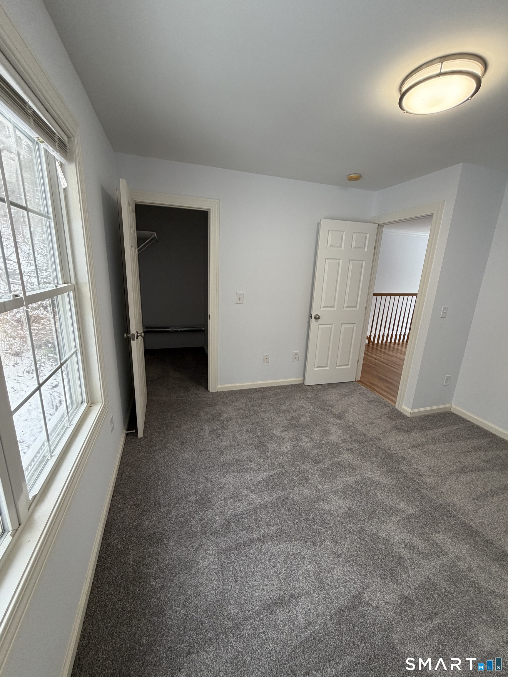 55 A Butterfield Road Newtown, CT 06470 - Photo 25 of 33 an empty room with windows and closet