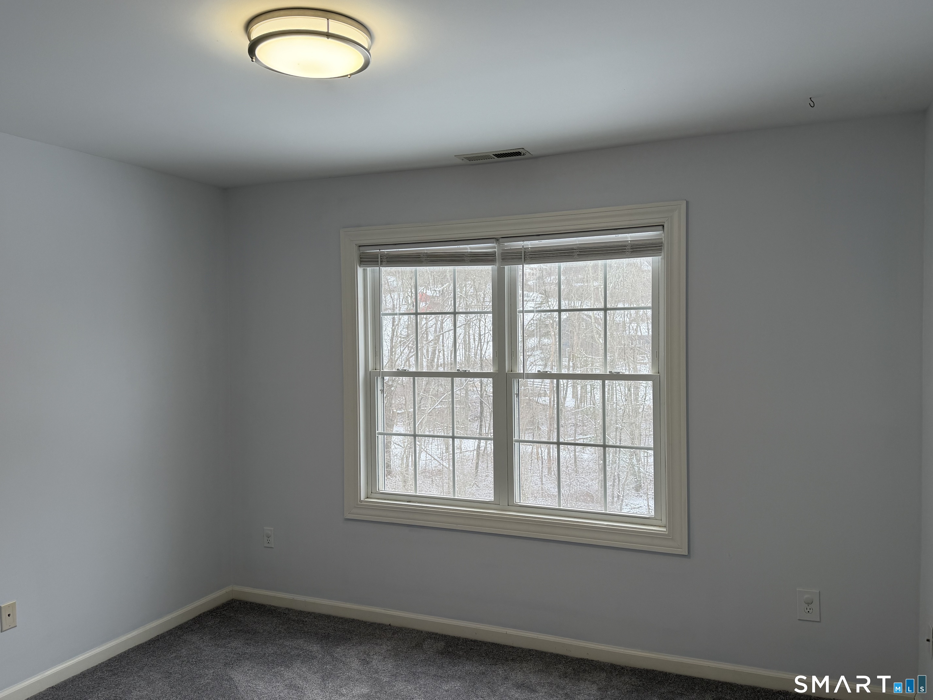 55 A Butterfield Road Newtown, CT 06470 - Photo 26 of 33 an empty room with a window