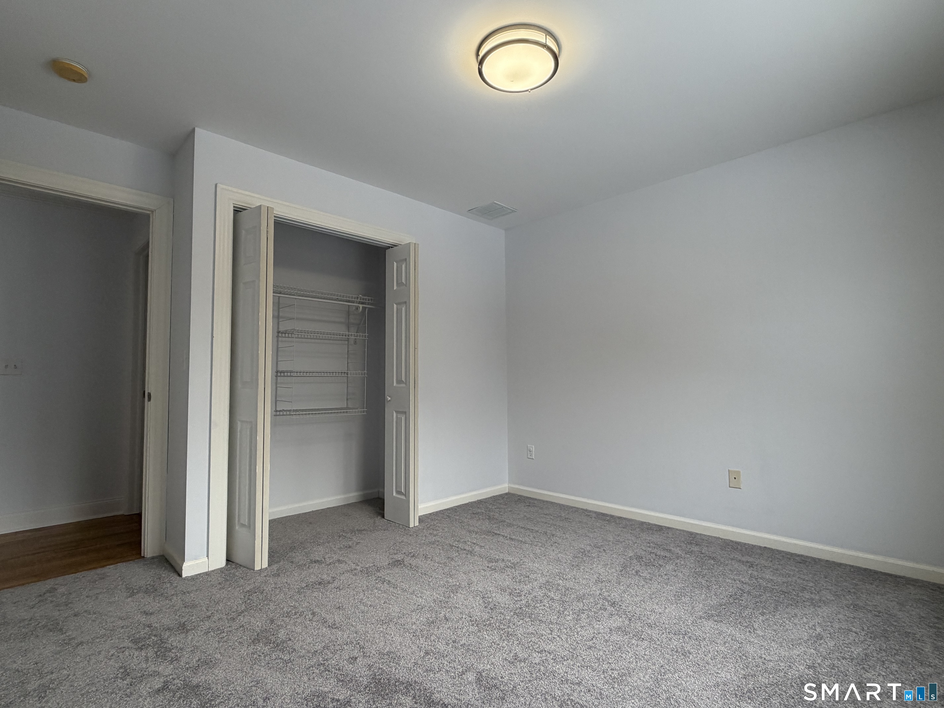 55 A Butterfield Road Newtown, CT 06470 - Photo 27 of 33 an empty room with closet