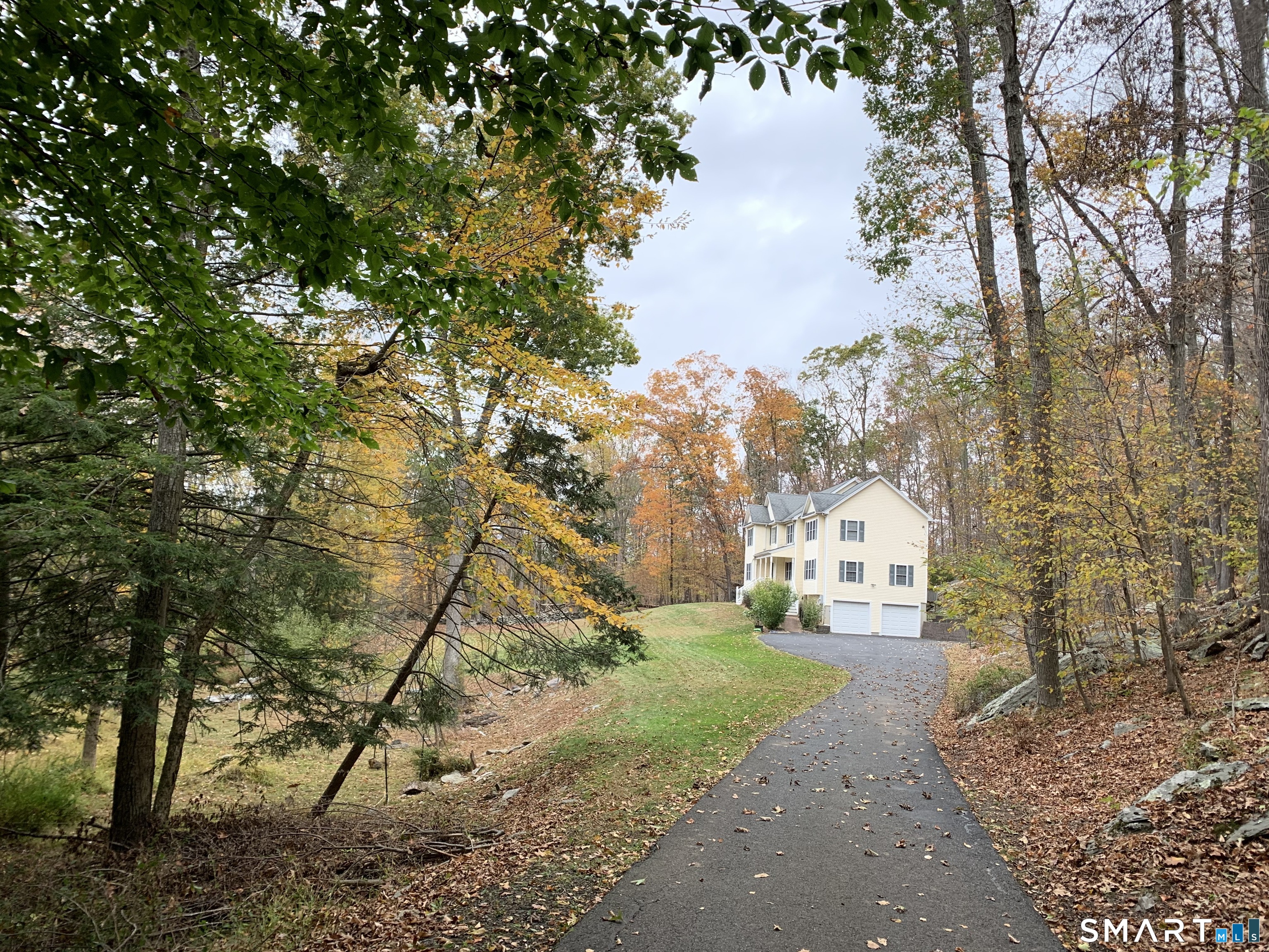 55 A Butterfield Road Newtown, CT 06470 - Photo 3 of 33 a view of a yard in front of the house