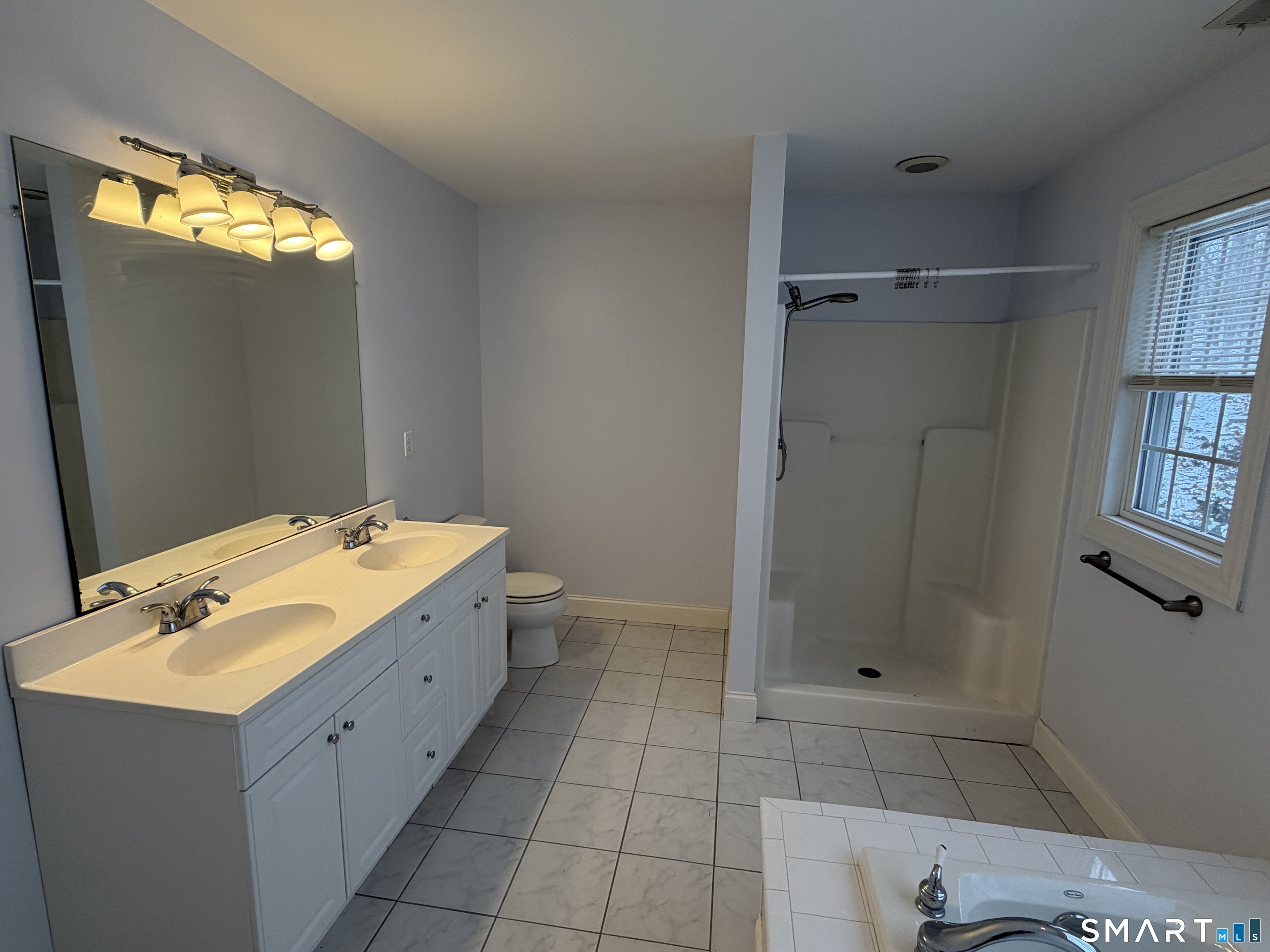 55 A Butterfield Road Newtown, CT 06470 - Photo 31 of 33 a bathroom with a bathtub sink and mirror