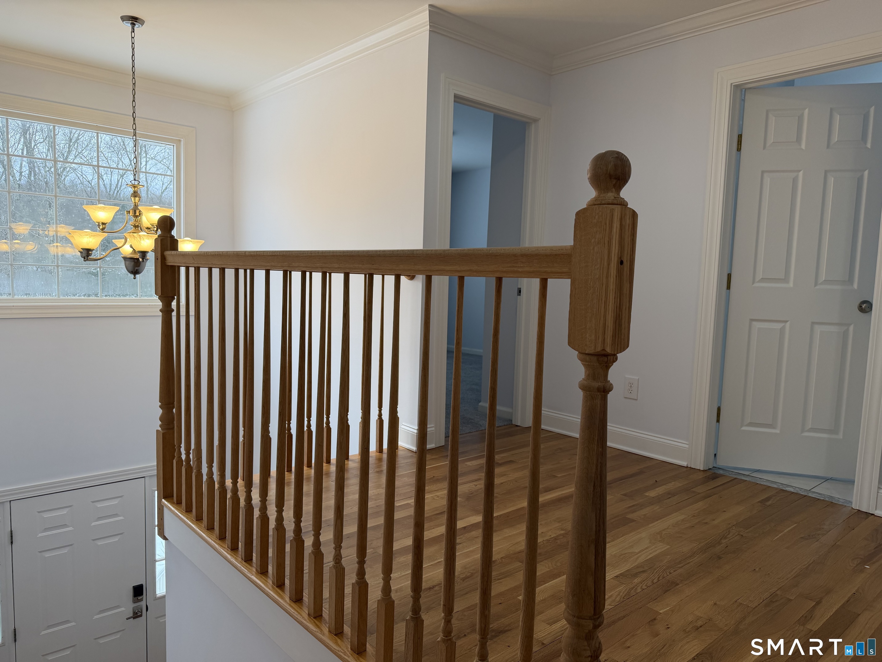 55 A Butterfield Road Newtown, CT 06470 - Photo 33 of 33 a view of hallway with wooden floor and stairs