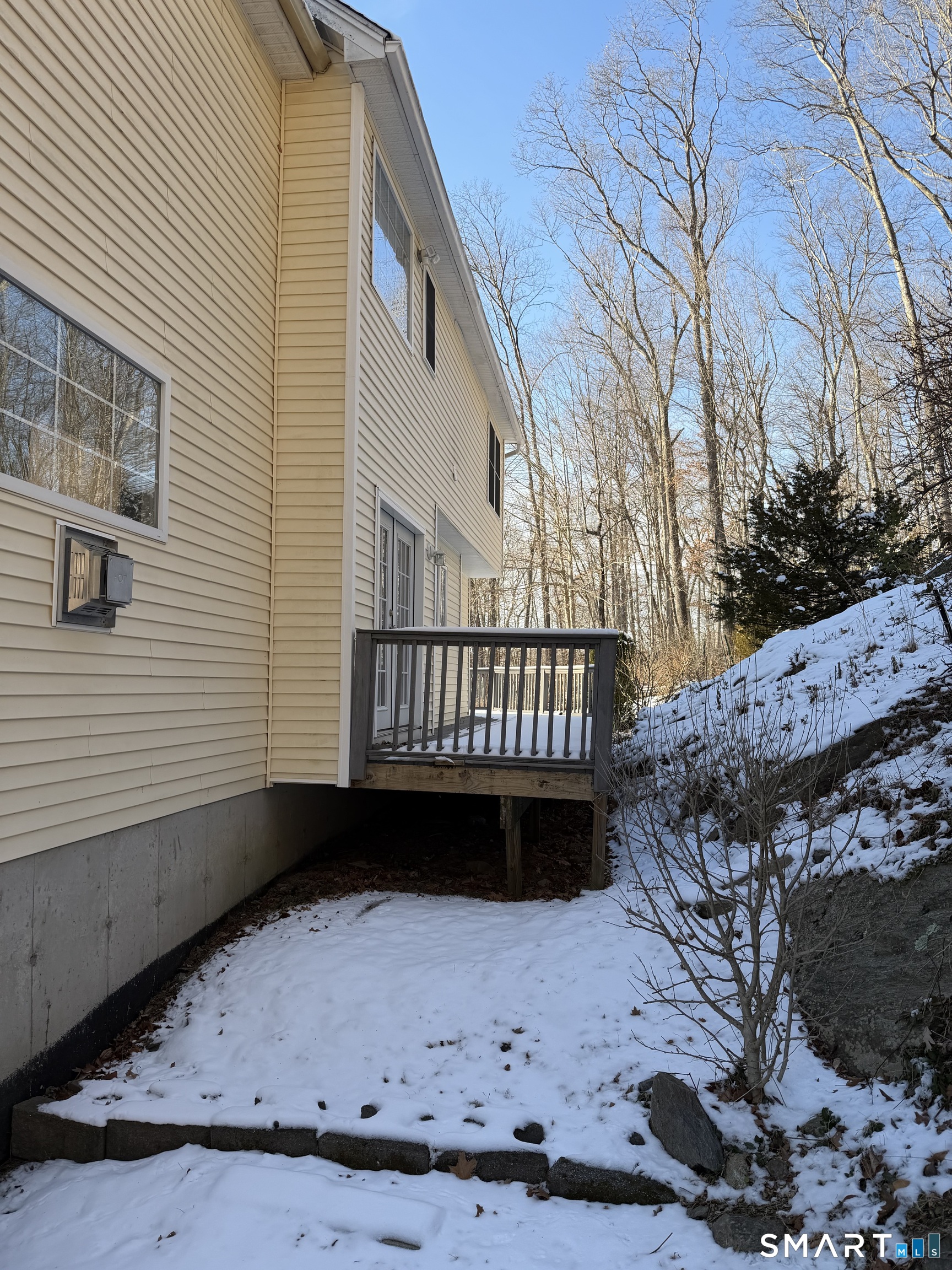 55 A Butterfield Road Newtown, CT 06470 - Photo 6 of 33 a view of a backyard with a wooden deck