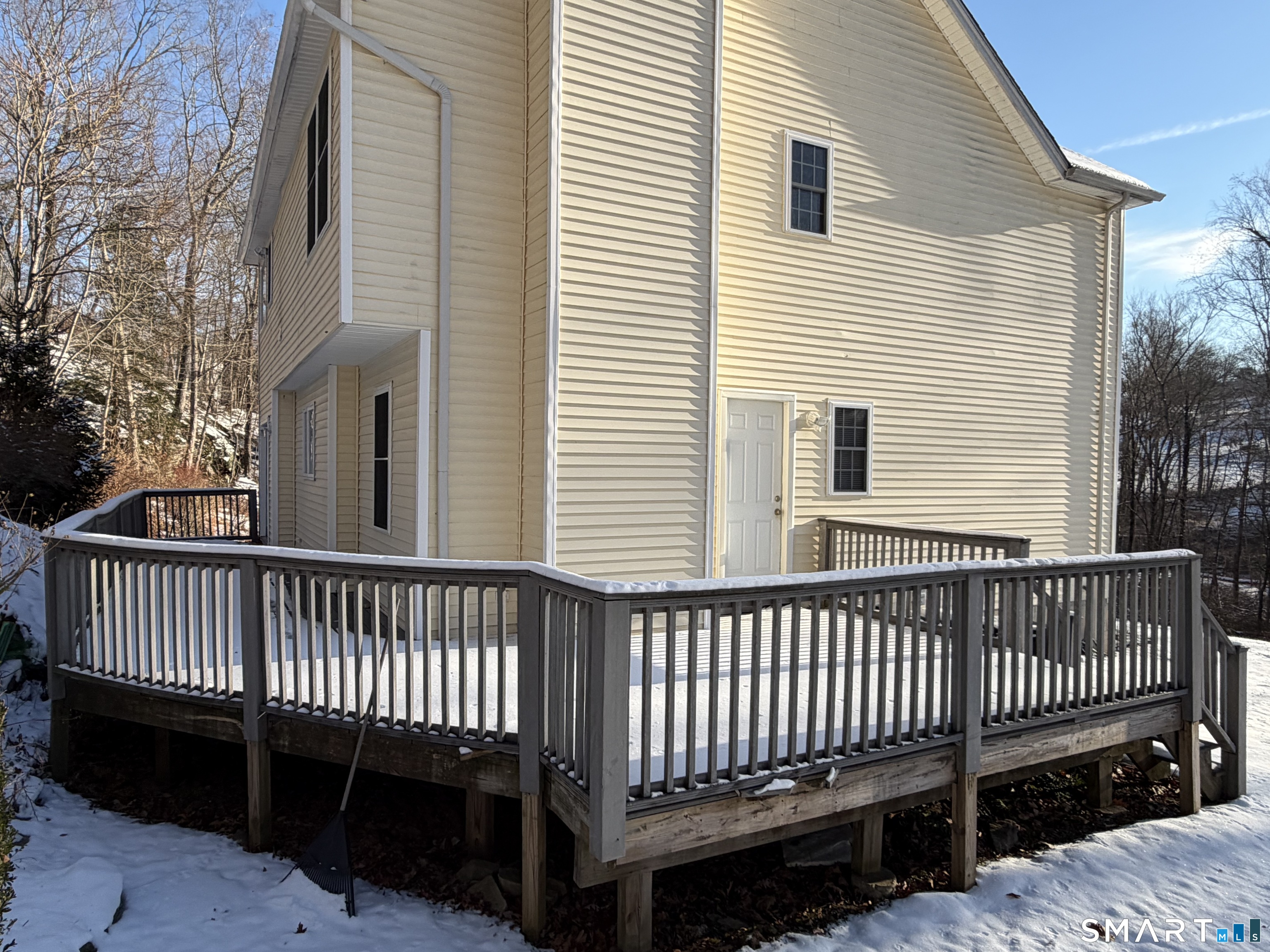 55 A Butterfield Road Newtown, CT 06470 - Photo 7 of 33 a view of a roof deck with a fence
