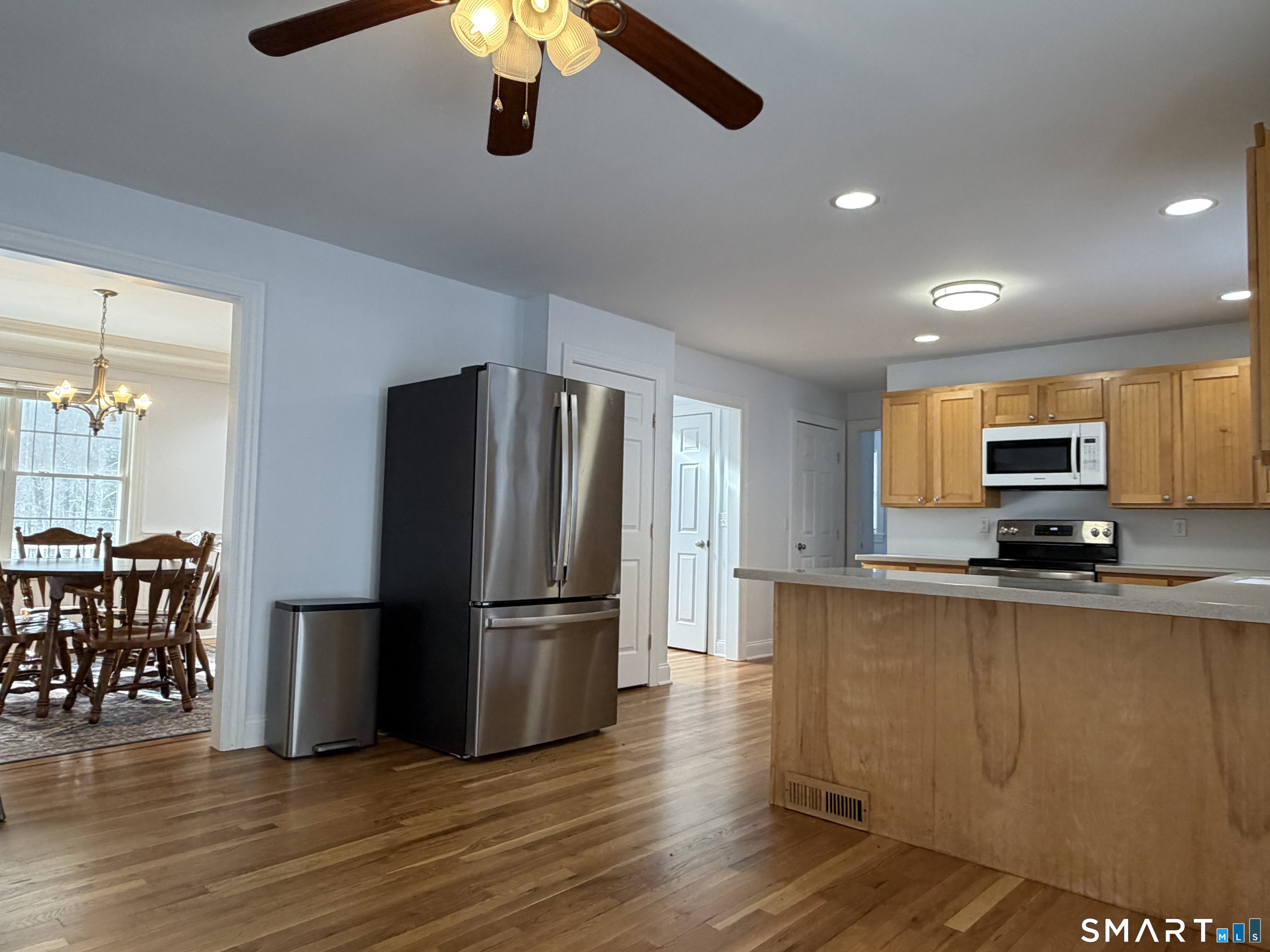 55 A Butterfield Road Newtown, CT 06470 - Photo 10 of 33 a kitchen with stainless steel appliances a refrigerator and a stove top oven