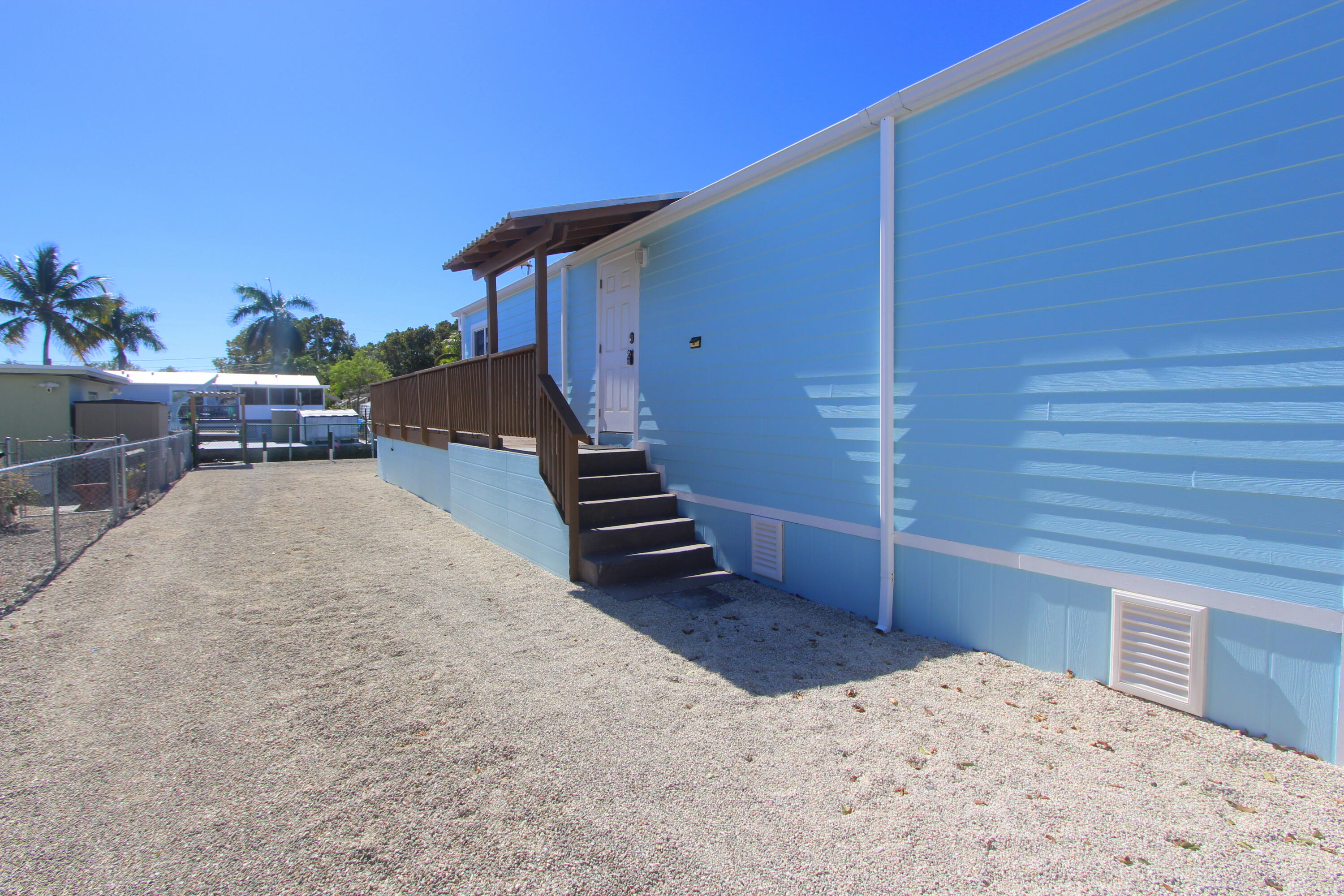 211 Lance Lane Key Largo, FL 33037 - Photo 12 of 52 a view of a backyard with furniture and deck