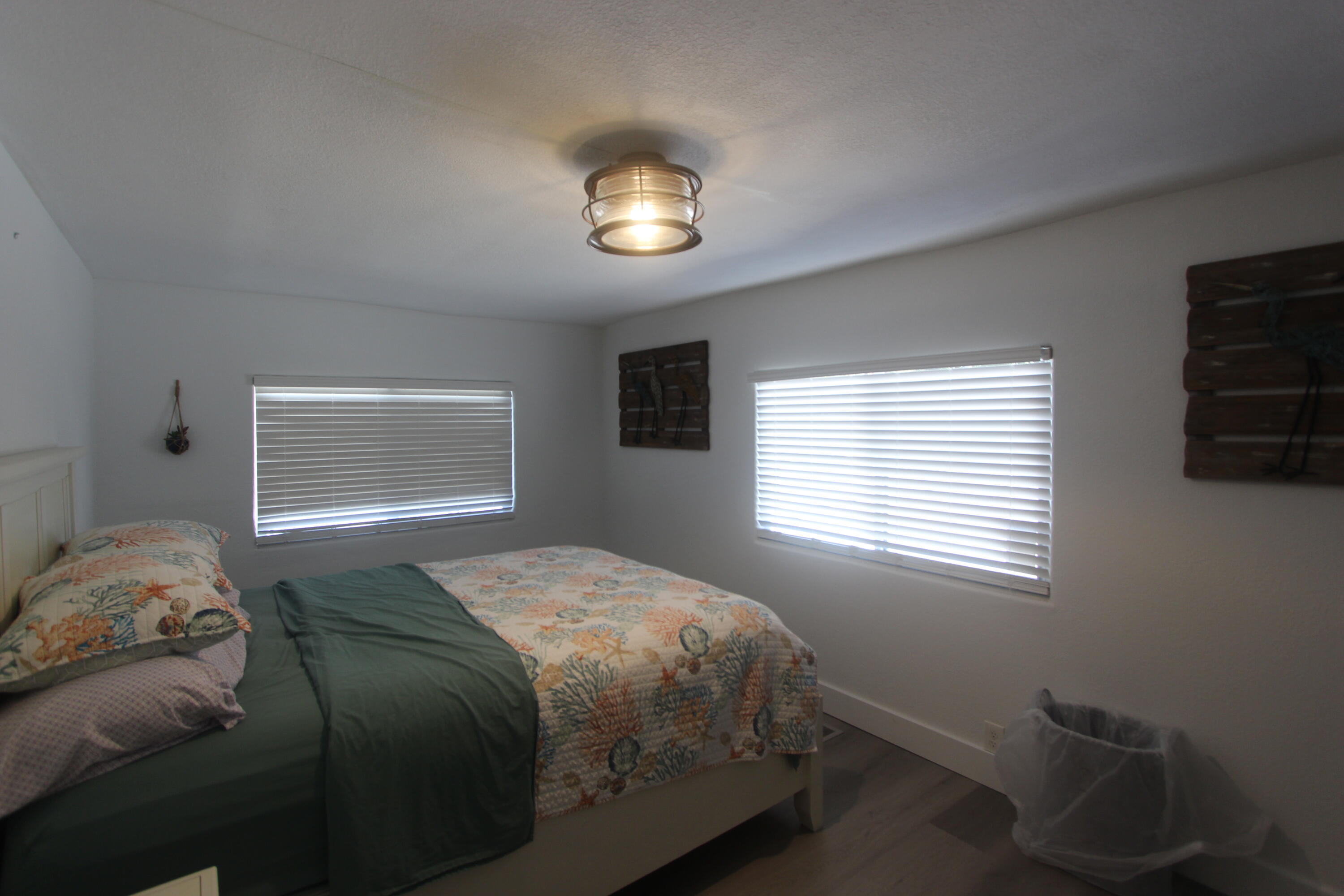 211 Lance Lane Key Largo, FL 33037 - Photo 24 of 52 a bedroom with a bed and a window