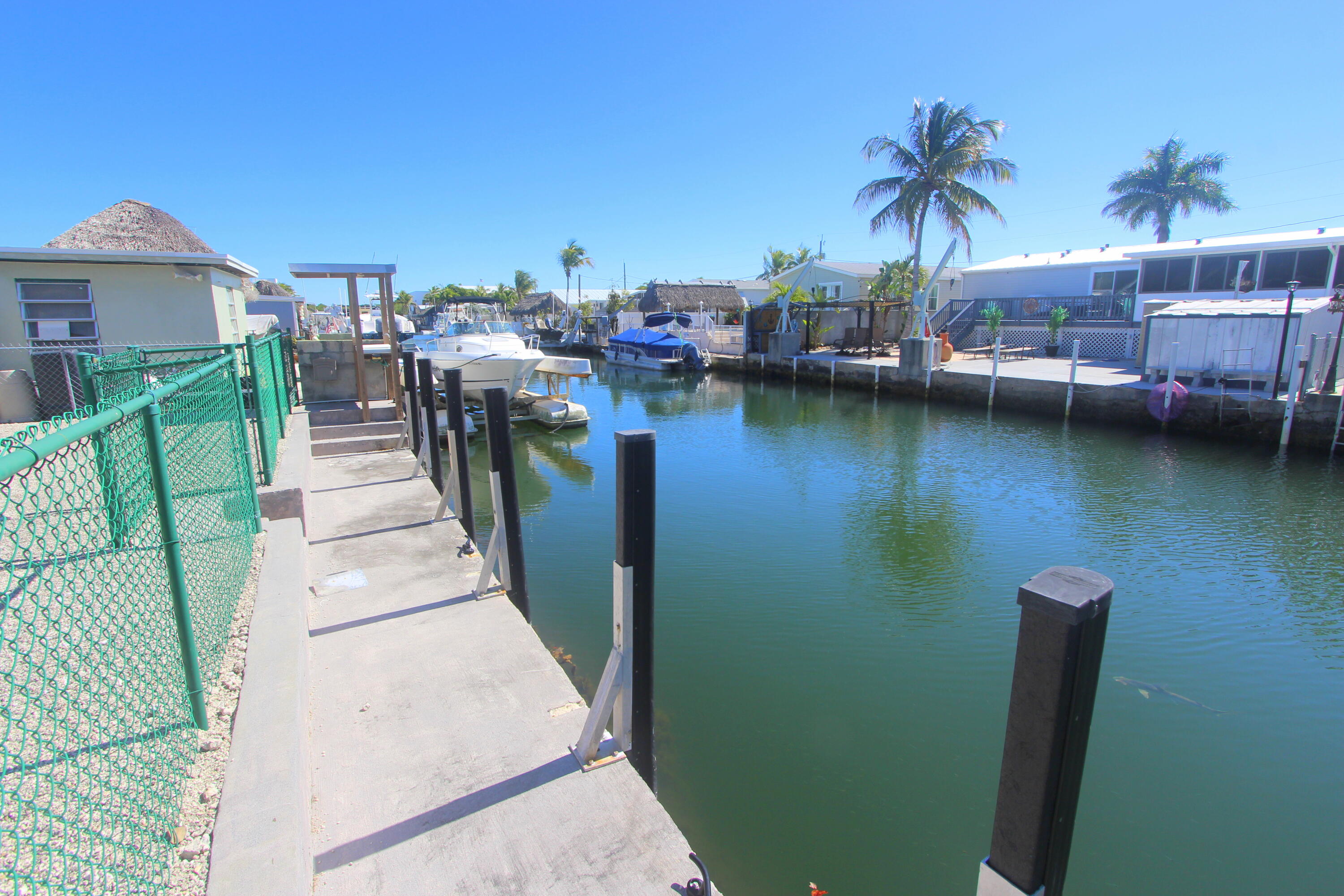 211 Lance Lane Key Largo, FL 33037 - Photo 30 of 52 a view of a lake with a house