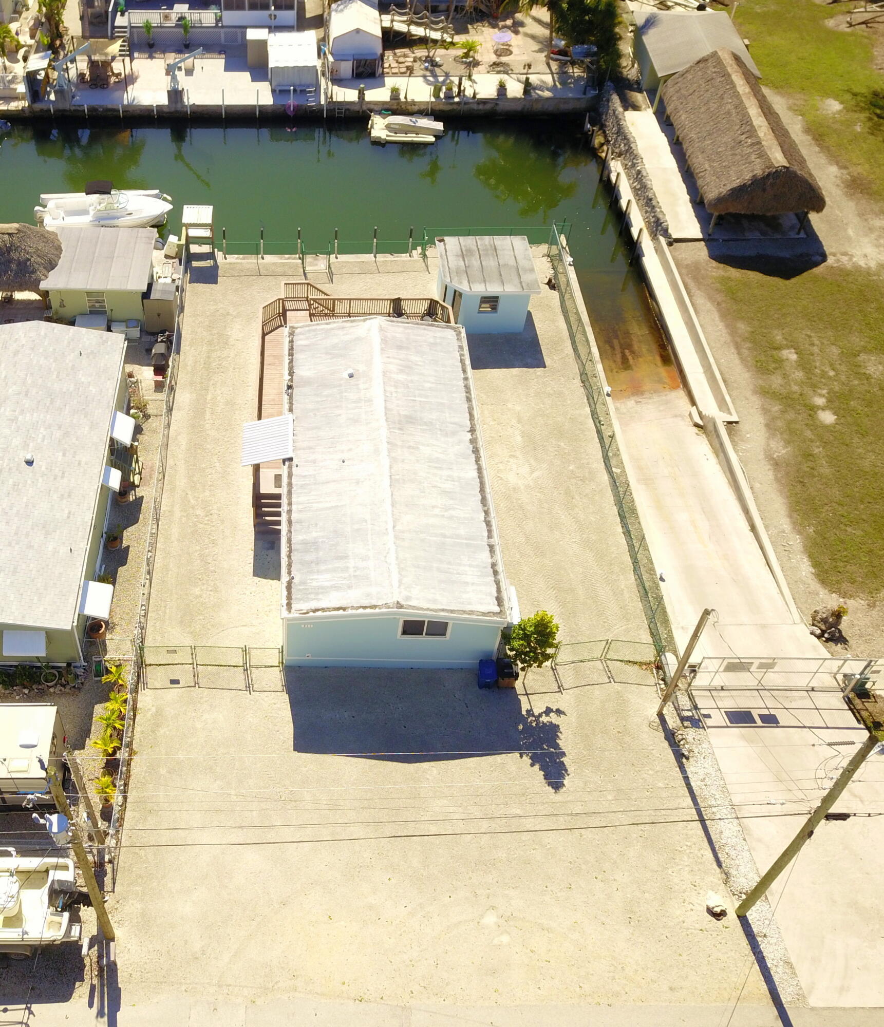 211 Lance Lane Key Largo, FL 33037 - Photo 38 of 52 a view of a swimming pool with a lounge chairs