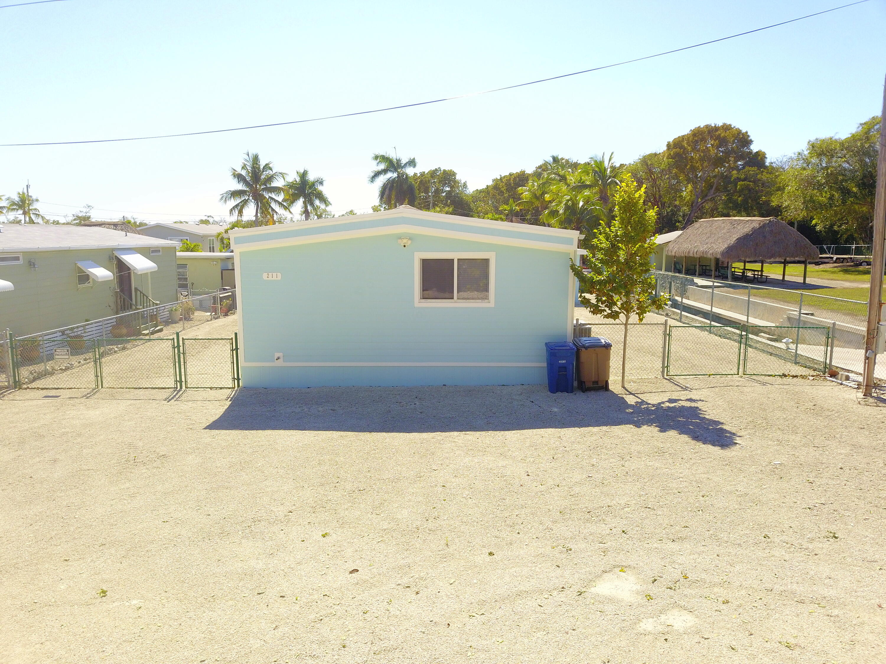 211 Lance Lane Key Largo, FL 33037 - Photo 39 of 52 a view of a terrace with a bench