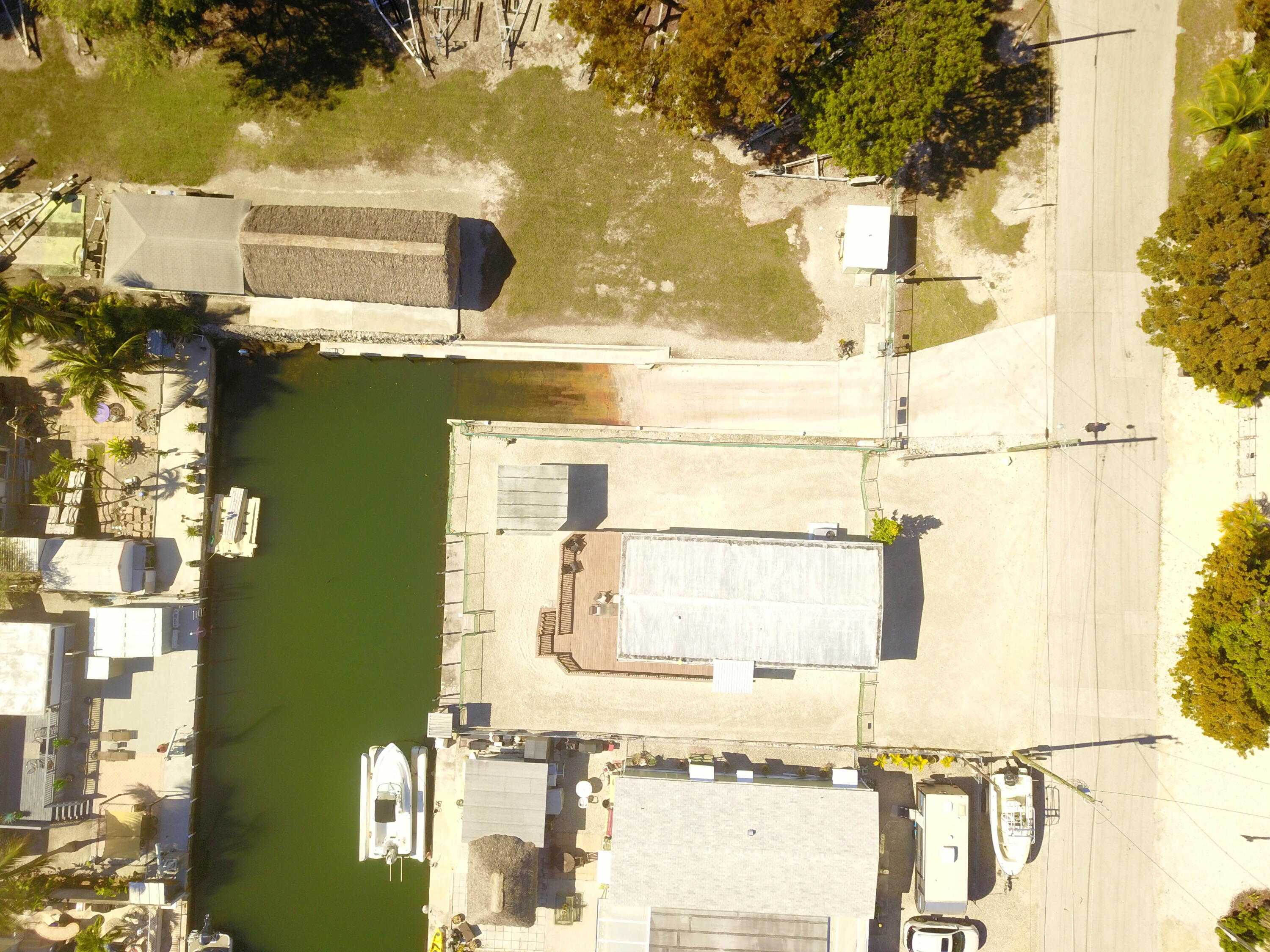 211 Lance Lane Key Largo, FL 33037 - Photo 40 of 52 a front view of a house with a yard