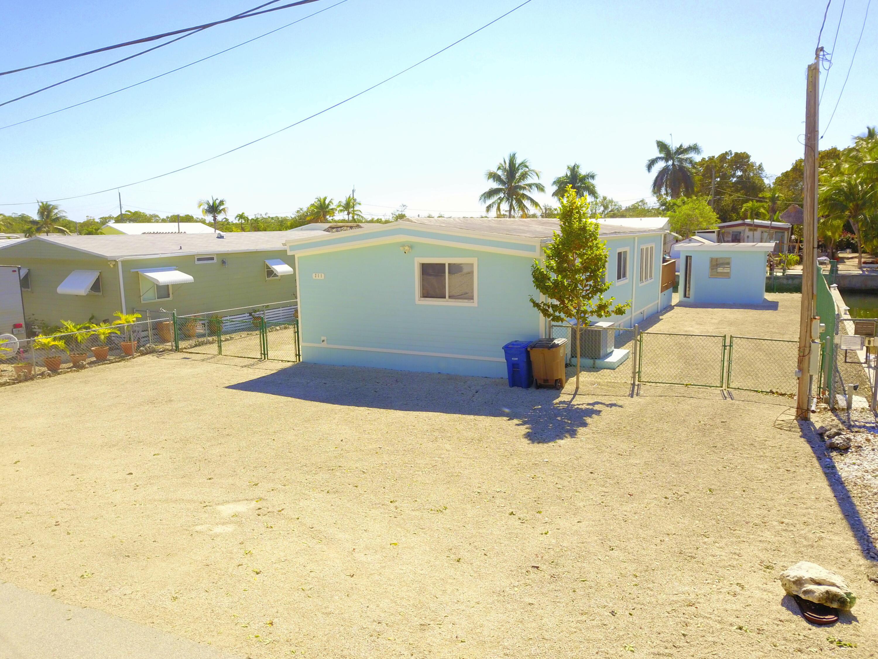 211 Lance Lane Key Largo, FL 33037 - Photo 4 of 52 a view of a terrace with chairs
