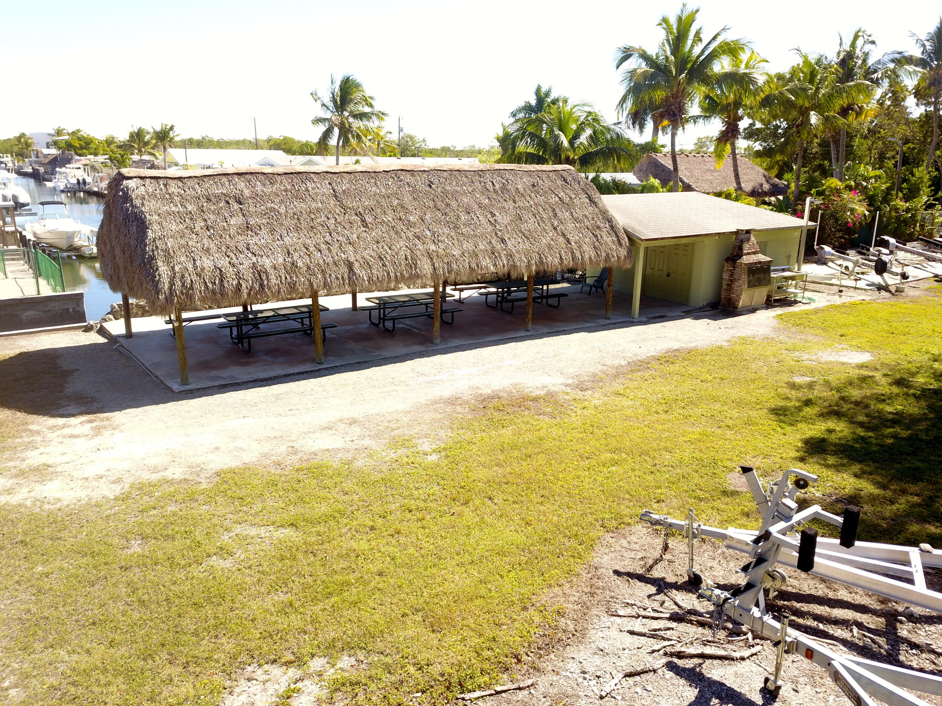 211 Lance Lane Key Largo, FL 33037 - Photo 48 of 52 a view of a swimming pool with an outdoor space and seating area