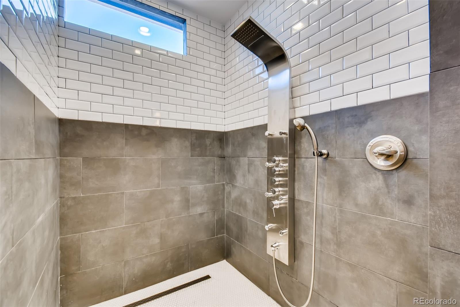 27732 Squaw Pass Road Evergreen, CO 80439 - Photo 25 of 38 a bathroom with a shower