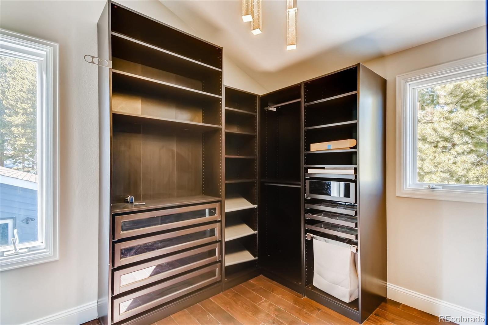 27732 Squaw Pass Road Evergreen, CO 80439 - Photo 26 of 38 a room with a closet and a window