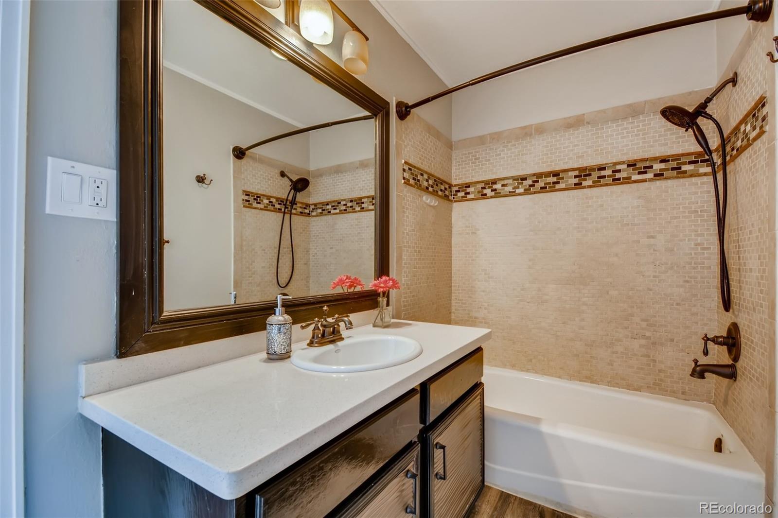27732 Squaw Pass Road Evergreen, CO 80439 - Photo 29 of 38 a bathroom with a sink mirror and a bathtub