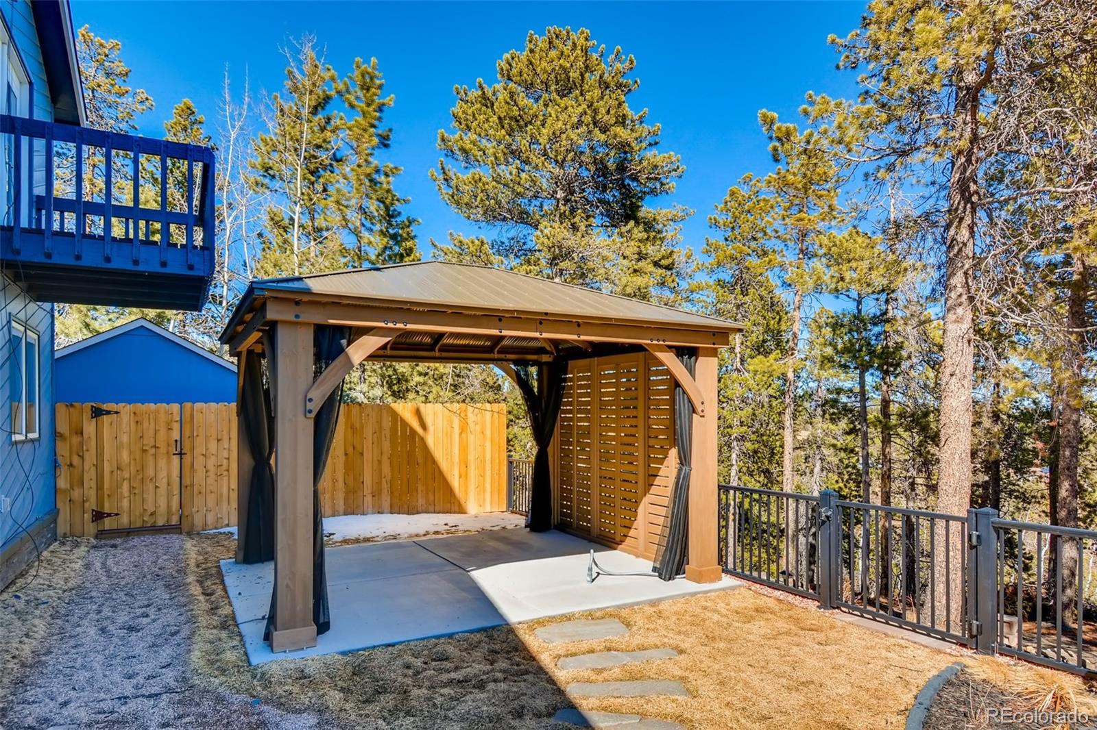 27732 Squaw Pass Road Evergreen, CO 80439 - Photo 33 of 38 a front view of a house with garden