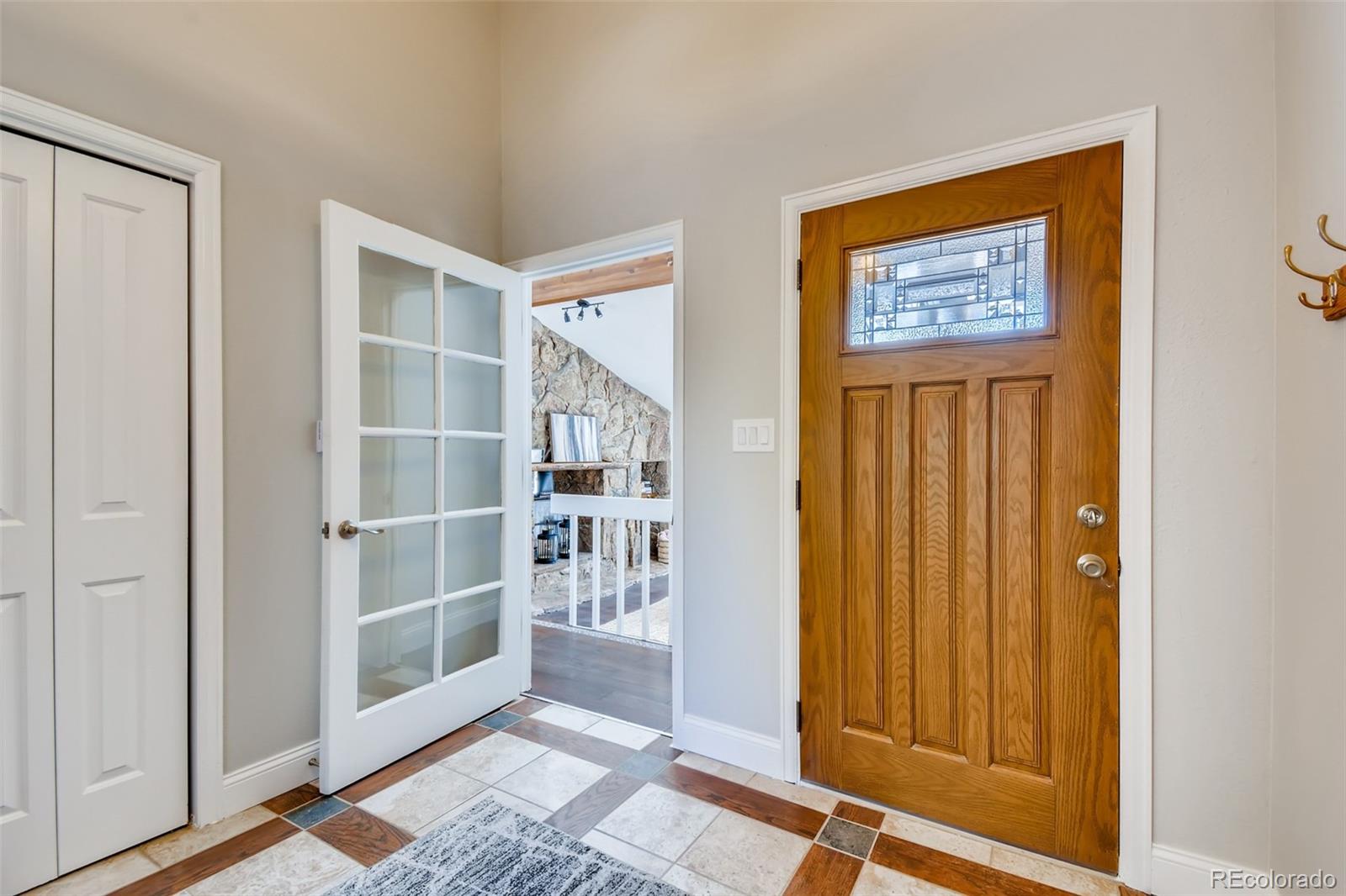 27732 Squaw Pass Road Evergreen, CO 80439 - Photo 4 of 38 a view of front door