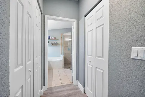a bathroom with a glass shower door and a bathroom