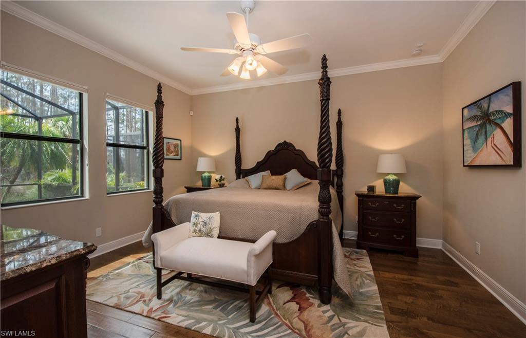 4423 Raffia Palm Circle Naples, FL 34119 - Photo 13 of 25 1st floor master offers plank wood flooring, crown molding and great morning sun!
