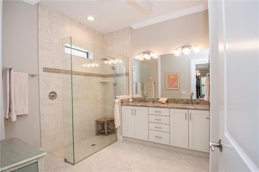 4423 Raffia Palm Circle Naples, FL 34119 - Photo 14 of 25 Master bath-upgraded cabinets, granite, crown molding, dual sinks, and a huge dual head shower!