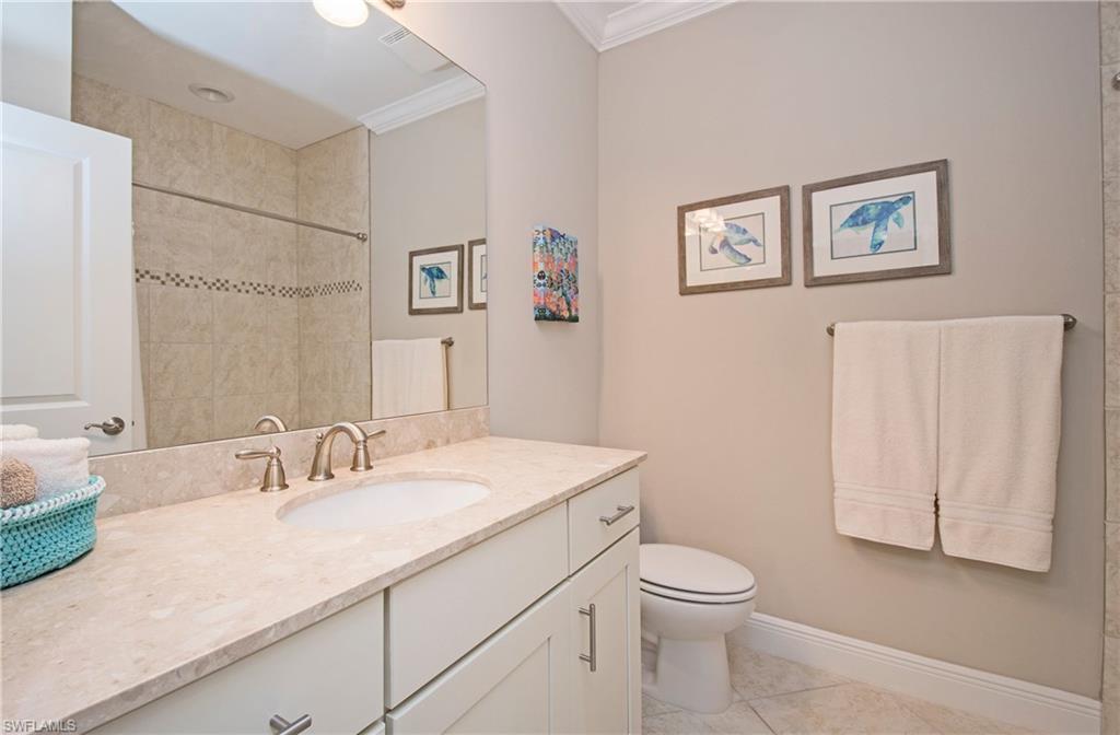 4423 Raffia Palm Circle Naples, FL 34119 - Photo 20 of 25 Marble 3rd bath with shower/tub.
