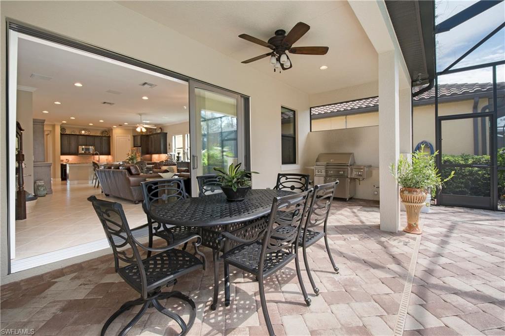 4423 Raffia Palm Circle Naples, FL 34119 - Photo 24 of 25 Open living area opens up to the outdoor space & outdoor kitchen hook-up.