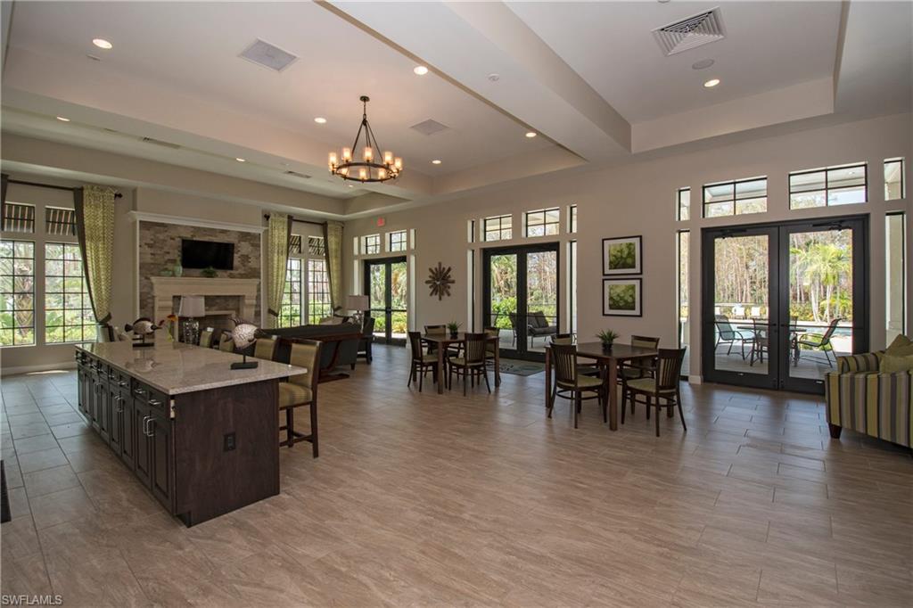 4423 Raffia Palm Circle Naples, FL 34119 - Photo 25 of 25 Fabulous community amenities- clubhouse with fireplace, kitchen, lap pool & fitness center.