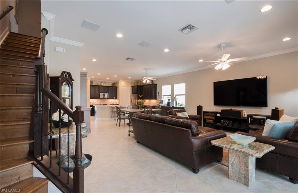 4423 Raffia Palm Circle Naples, FL 34119 - Photo 8 of 25 Custom wood & wrought iron staircase!
