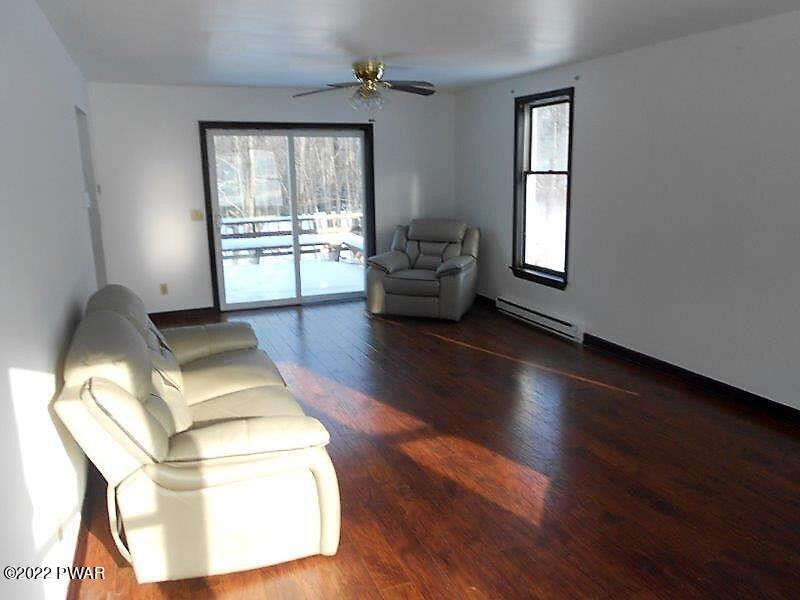 126 Maple Ridge Drive Hawley, PA 18428 - Photo 11 of 40 a living room with furniture and a window