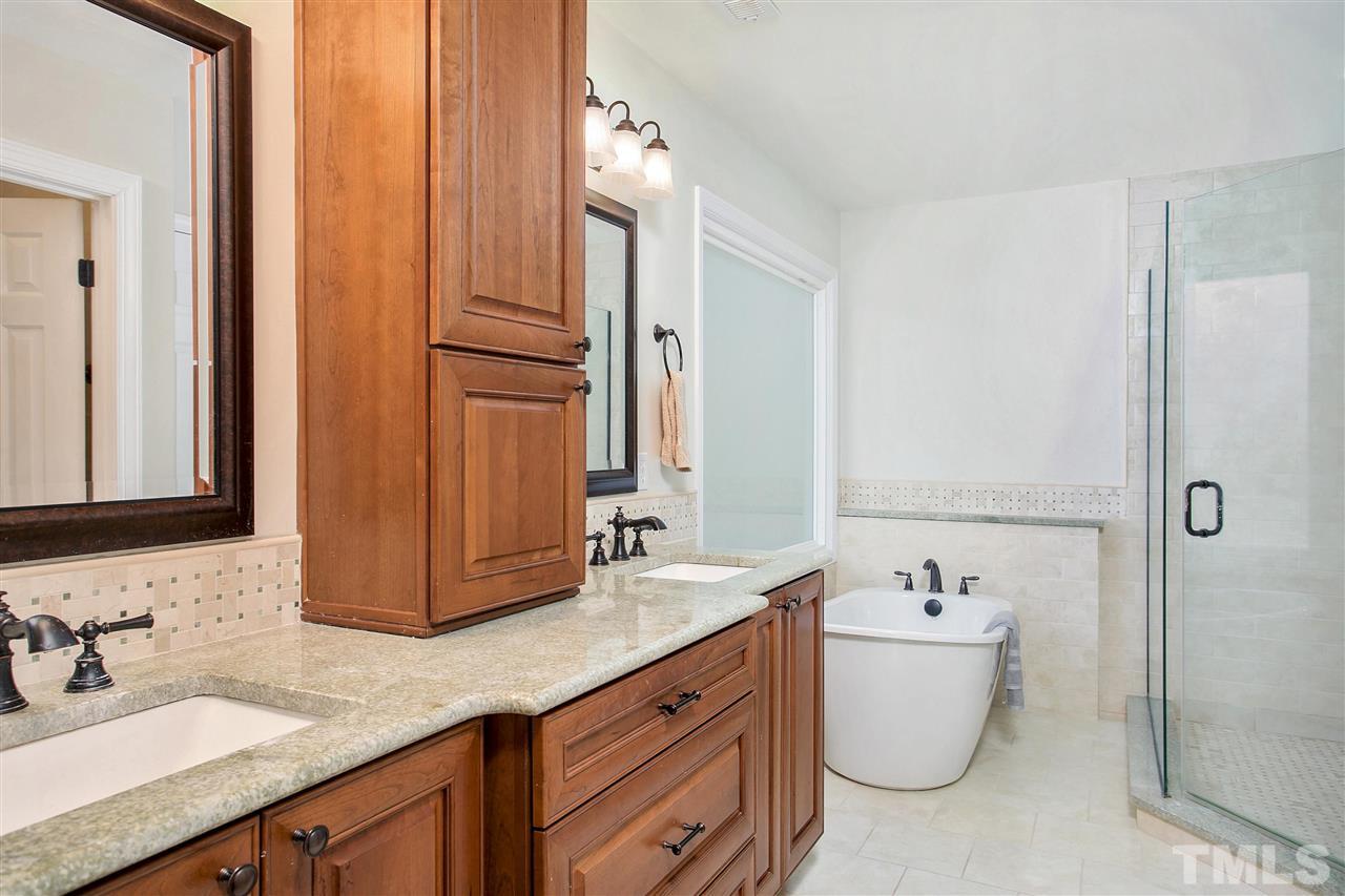 7102 Spring Ridge Road Cary, NC 27518 - Photo 15 of 25 STUNNING UPGRADES WITH STAND ALONE TUB, NEWER CABINETS, FIXTURES AND TOILET!